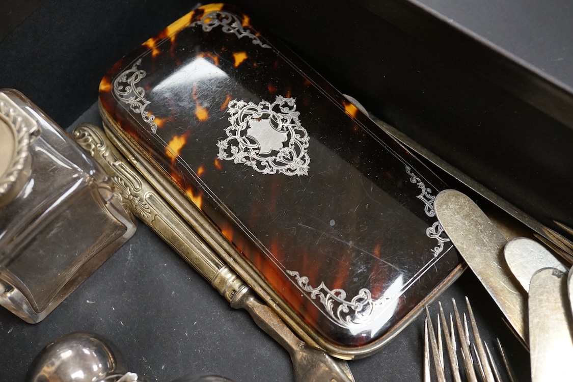 A late Victorian silver mounted glass hip flask, James Dixon & Sons, Sheffield, 1891, 15.5cm (lead solder), together with a silver mounted glass inkwell, assorted silver handled plated dessert eaters(a.f.) and a tortoise